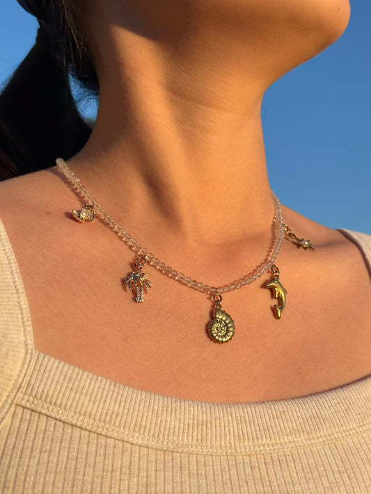 Crystal clear quartz Necklace with golden ocean charms