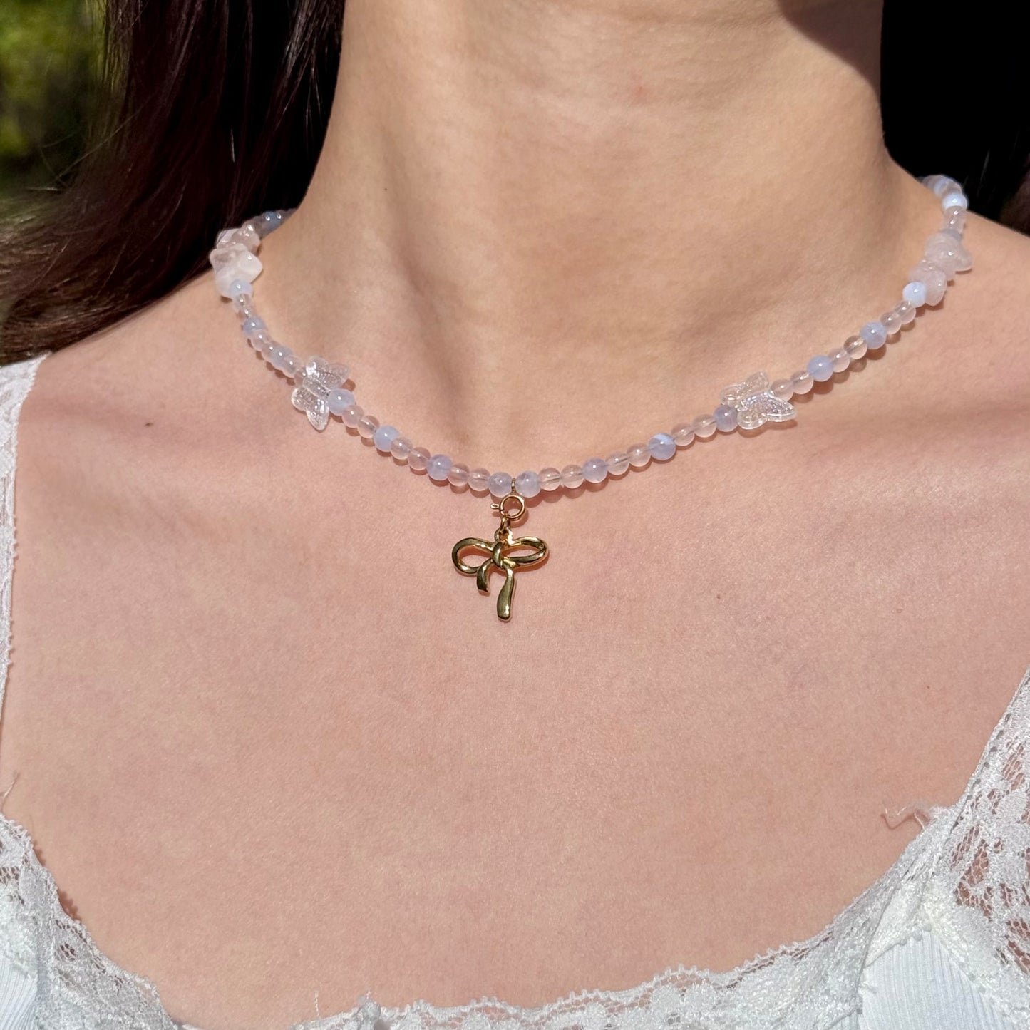 Rose quartz and blue lace agate statement Necklace with a gold bow pendant