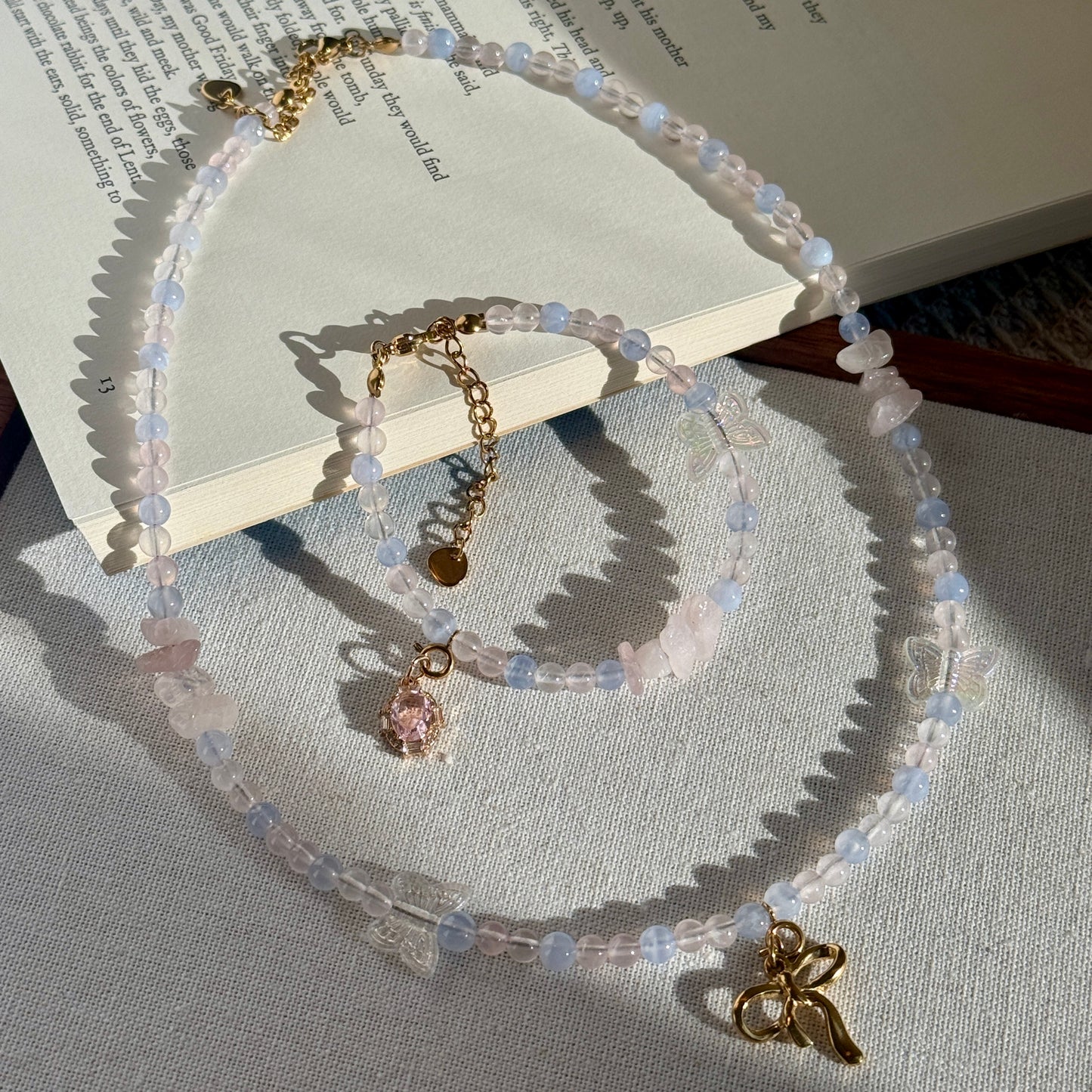 Pink and blue crystal Necklace and bracelet set with golden bow charm