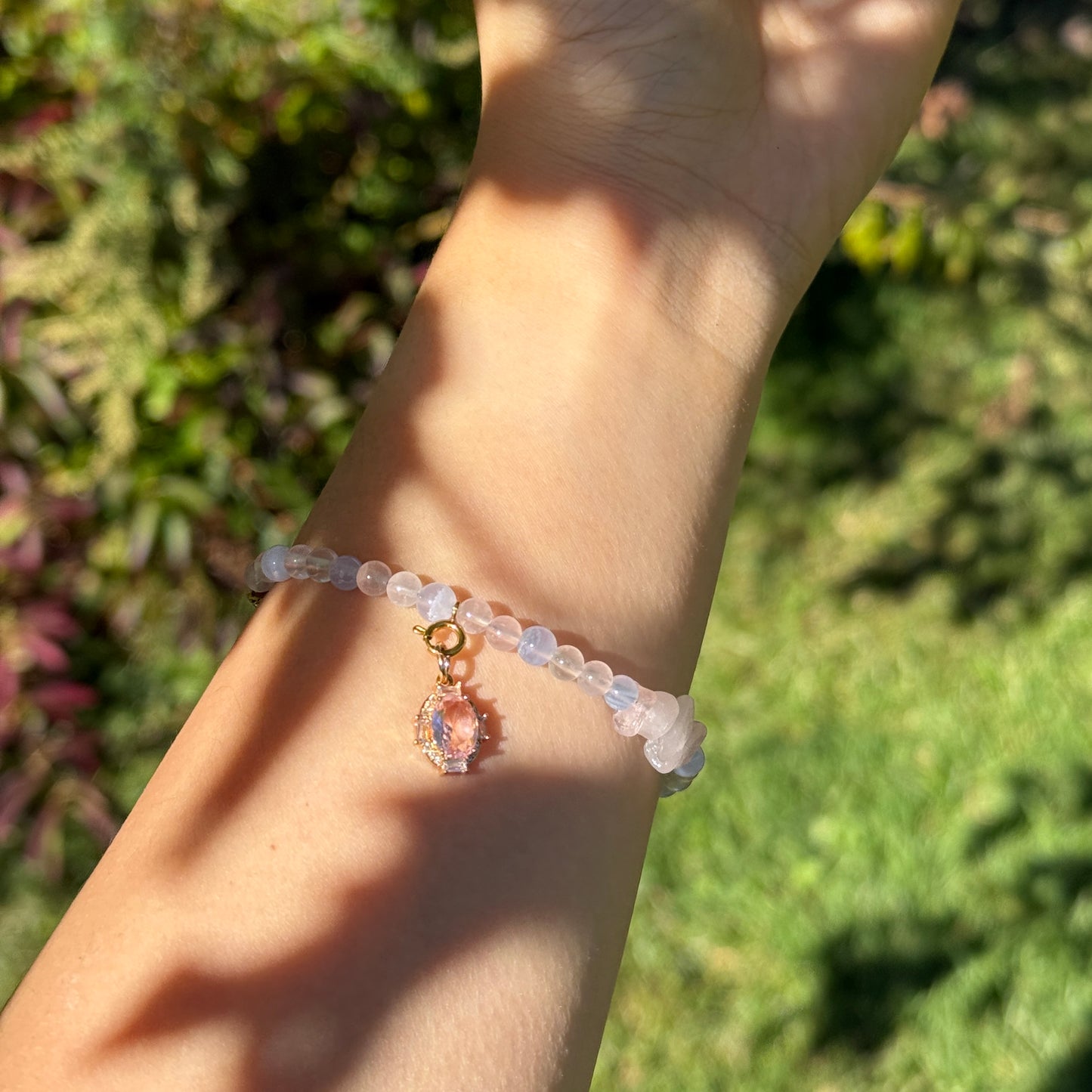 Pink and Blue Crystal Beaded Bracelet with a pink gemstone charm