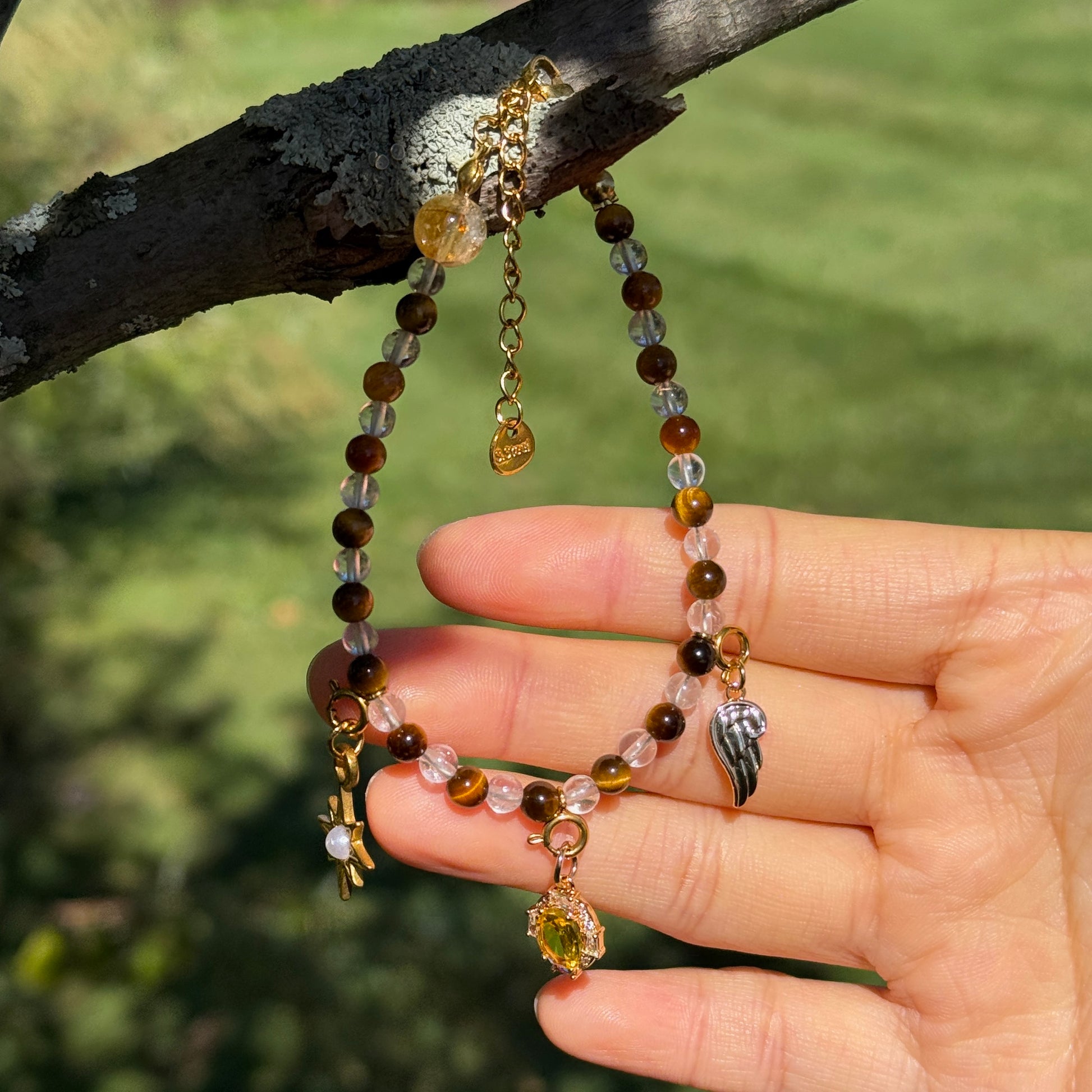 Tiger's Eye & Clear Quartz Beaded Bracelet with Angel wing, Star, and Gemstone Charms.