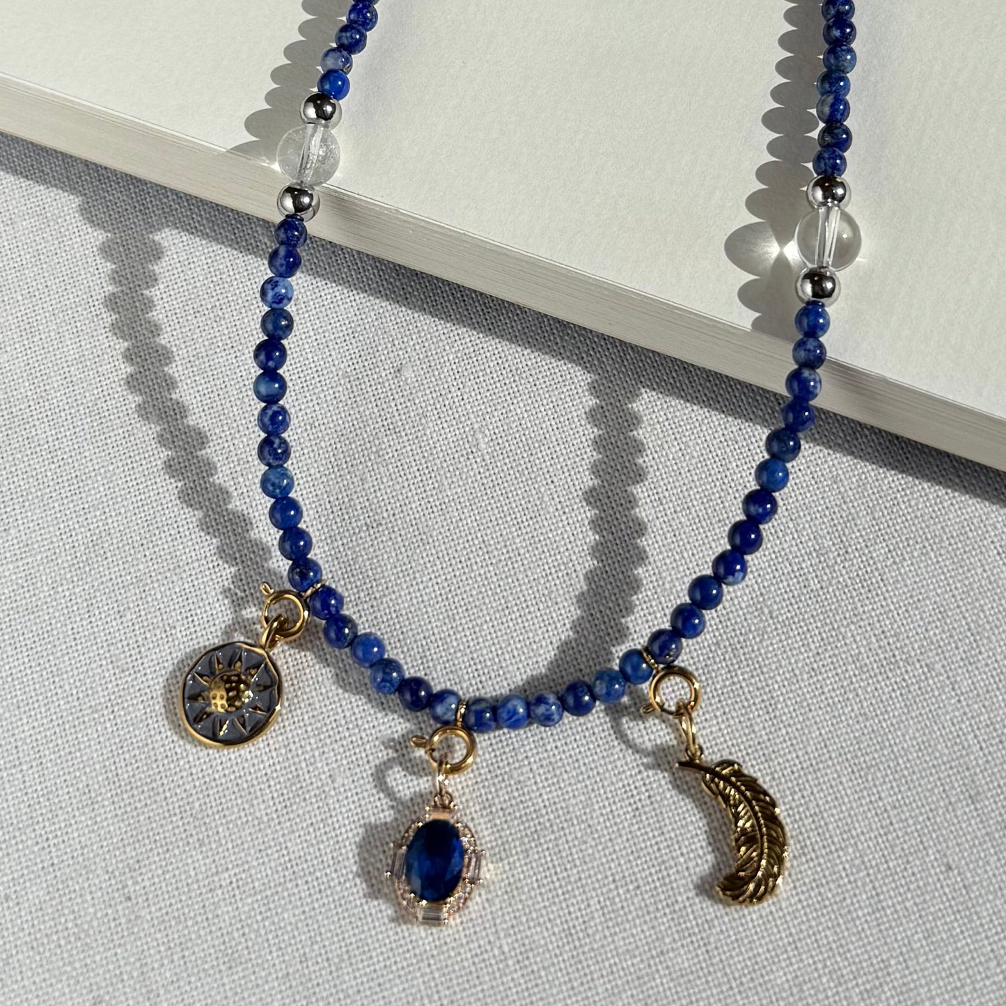 Blue crystal beaded necklace with gold charms