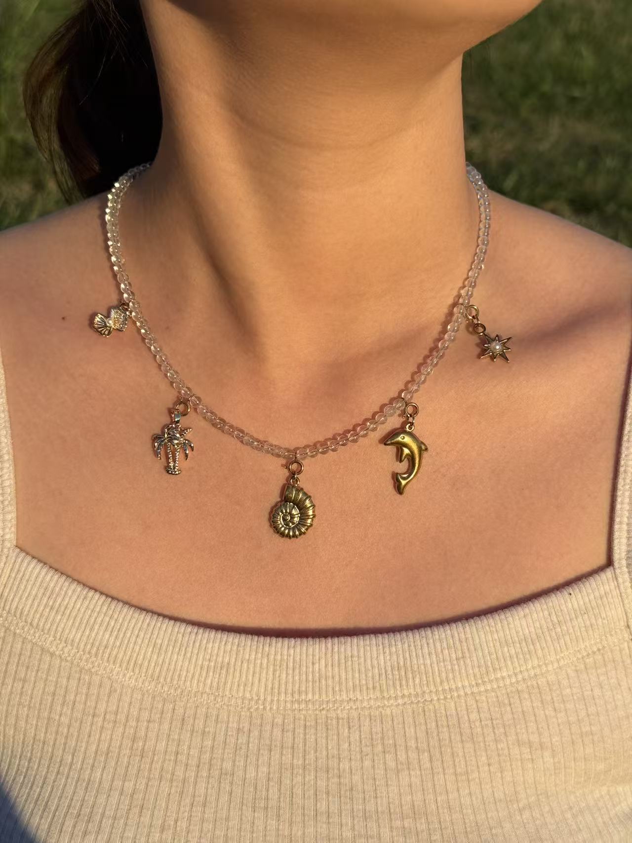 Crystal clear quartz Necklace with golden ocean charms
