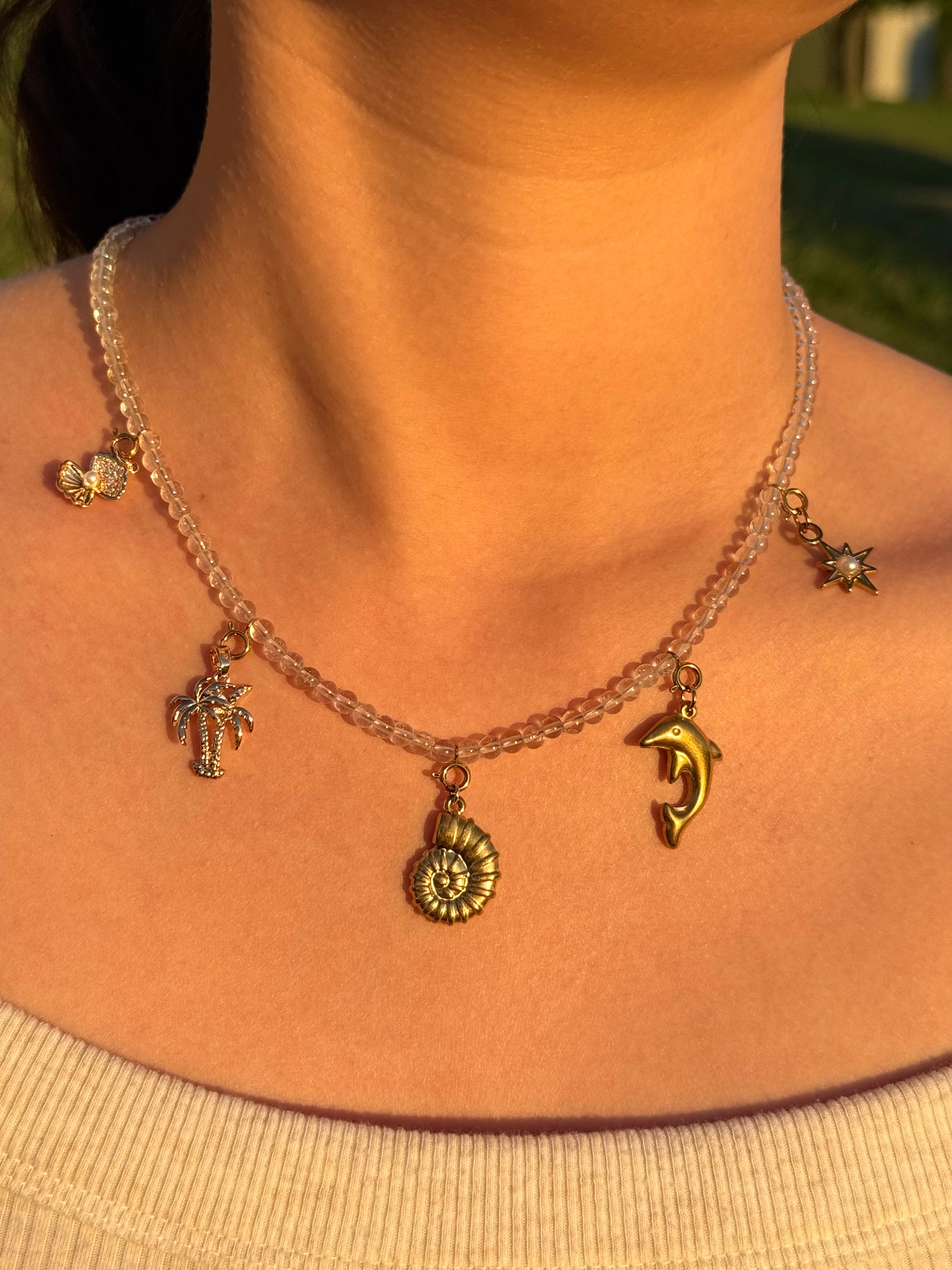 Crystal clear quartz Necklace with golden ocean charms
